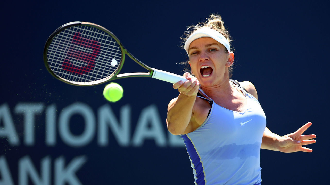 TORONTO, ON - AUGUST 12: Simona Halep of Romania hits a shot against Coco Gauff of the United States during the National Bank Open, part of the Hologic WTA Tour, at Sobeys Stadium on August 12, 2022 in Toronto, Ontario, Canada.