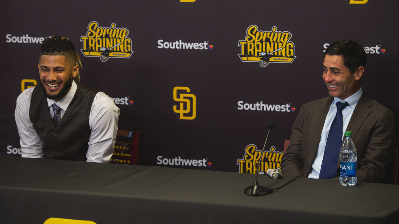 PEORIA, AZ - FEBRUARY 22: Infielder Fernando Tatis Jr. #23 and President of Baseball Operations and General Manager A.J. Preller of the San Diego Padres laugh during Tatis' press conference at the Peoria Sports Complex on February 22, 2021 in Peoria, Arizona.