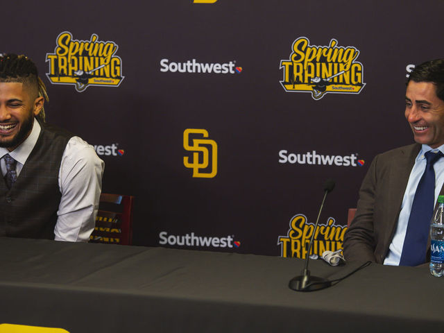PEORIA, AZ - FEBRUARY 22: Infielder Fernando Tatis Jr. #23 and President of Baseball Operations and General Manager A.J. Preller of the San Diego Padres laugh during Tatis' press conference at the Peoria Sports Complex on February 22, 2021 in Peoria, Arizona.