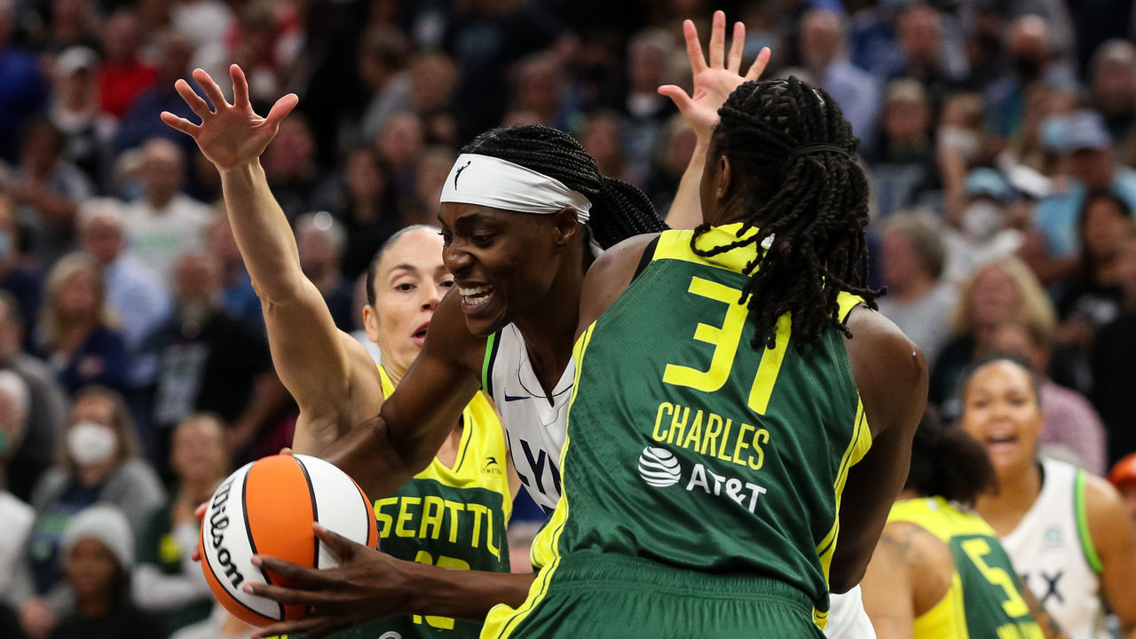 MINNEAPOLIS, MN - AUGUST 12: Sylvia Fowles #34 of the Minnesota Lynx drives to the basket while Tina Charles #31 of the Seattle Storm defends in the first quarter of the game at Target Center on August 12, 2022 in Minneapolis, Minnesota.