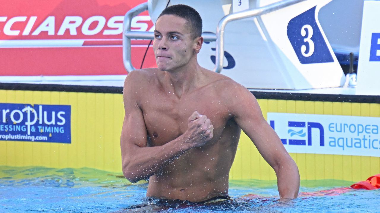 Romania's David Popovici reacts after winning and setting a new world record in the Men's 100m freestyle final event on August 13, 2022 at the LEN European Aquatics Championships in Rome.