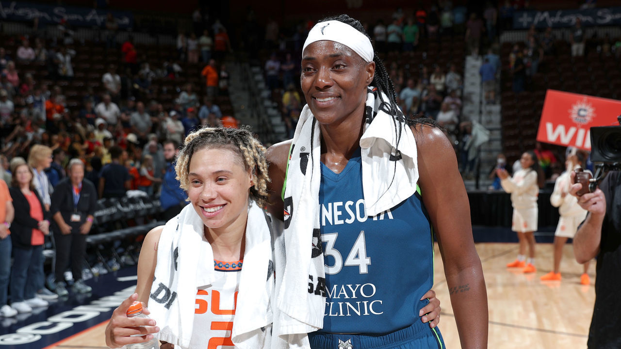 UNCASVILLE, CT - AUGUST 14: Sylvia Fowles #34 of the Minnesota Lynx smiles with Natisha Hiedeman #2 of the Connecticut Sun after the game on August 14, 2022 at Mohegan Sun Arena in Uncasville, Connecticut. NOTE TO USER: User expressly acknowledges and agrees that, by downloading and/or using this Photograph, user is consenting to the terms and conditions of the Getty Images License Agreement. Mandatory Copyright Notice: Copyright 2022 NBAE