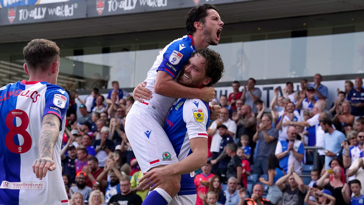 Blackburn Rovers' Sam Gallagher celebrates scoring their side's second goal of the game with team-mate Lewis Travis during the Sky Bet Championship match at Ewood Park, Blackburn. Picture date: Sunday August 14, 2022.