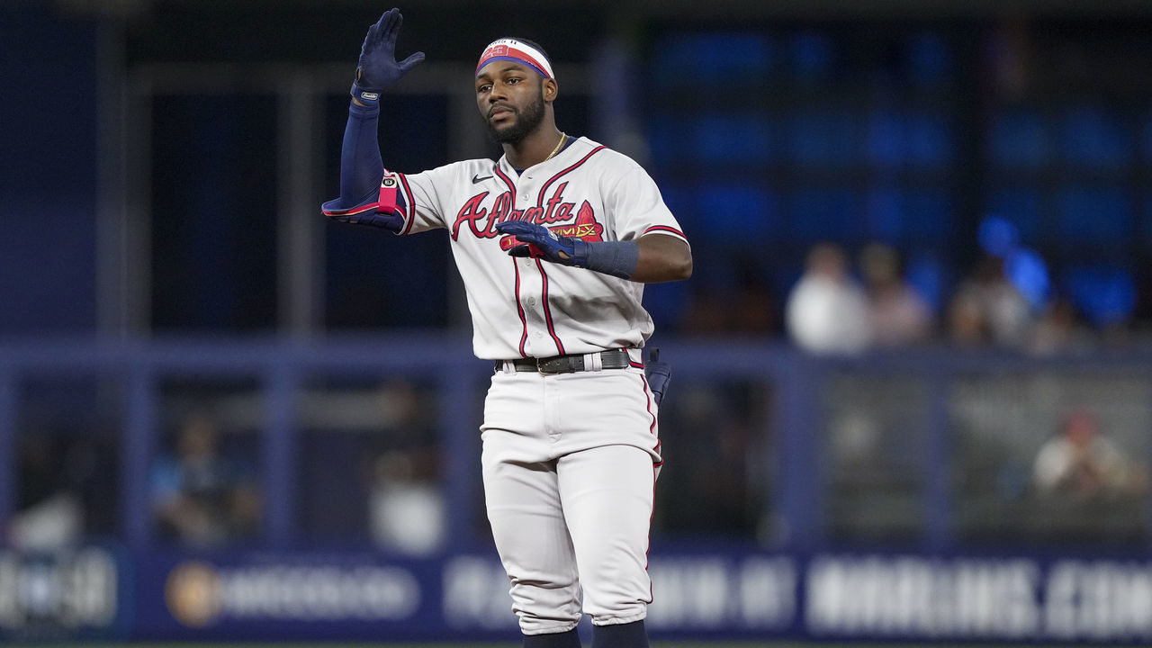 MIAMI, FLORIDA - AUGUST 13: Michael Harris II #23 of the Atlanta Braves celebrates toward the dugout after stealing second base during the eighth inning against the Miami Marlins at loanDepot park on August 13, 2022 in Miami, Florida.