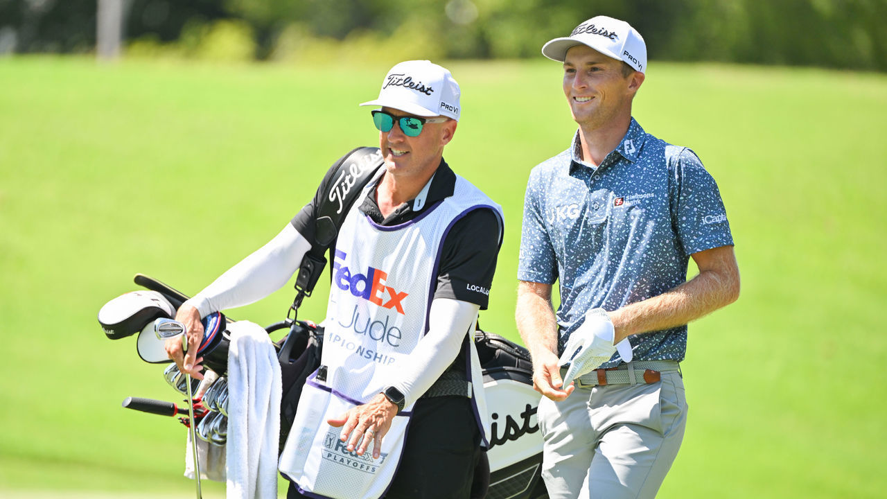 MEMPHIS, TENNESSEE - AUGUST 14: Will Zalatoris and his caddie walk together off the eighth tee box during the final round of the FedEx St. Jude Championship at TPC Southwind on August 14, 2022 in Memphis, Tennessee.