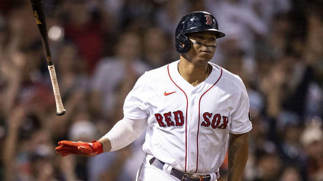 BOSTON, MA - AUGUST 14: Rafael Devers #11 of the Boston Red Sox reacts after hitting a two-run home run during the sixth inning of a game against the New York Yankees on August 14, 2022 at Fenway Park in Boston, Massachusetts.