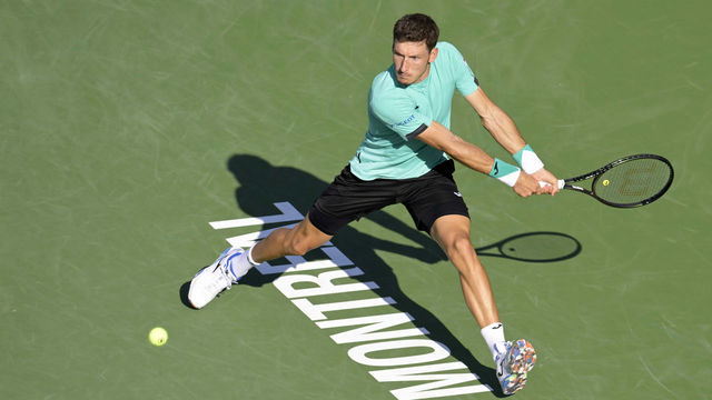 MONTREAL, QC - AUGUST 14: Pablo Carreno Busta (ESP) returns a ball during the mens final vs. opponent Hubert Hurkacz (POL) at National Bank Open at Stade IGA on August 14, 2022 in Montreal, Canada.