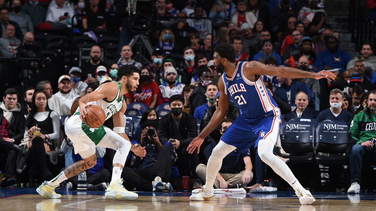 PHILADELPHIA, PA - JANUARY 14: Jayson Tatum #0 of the Boston Celtics handles the ball against Joel Embiid #21 of the Philadelphia 76ers on January 14, 2022 at Wells Fargo Center in Philadelphia, Pennsylvania. NOTE TO USER: User expressly acknowledges and agrees that, by downloading and/or using this Photograph, user is consenting to the terms and conditions of the Getty Images License Agreement. Mandatory Copyright Notice: Copyright 2021 NBAE