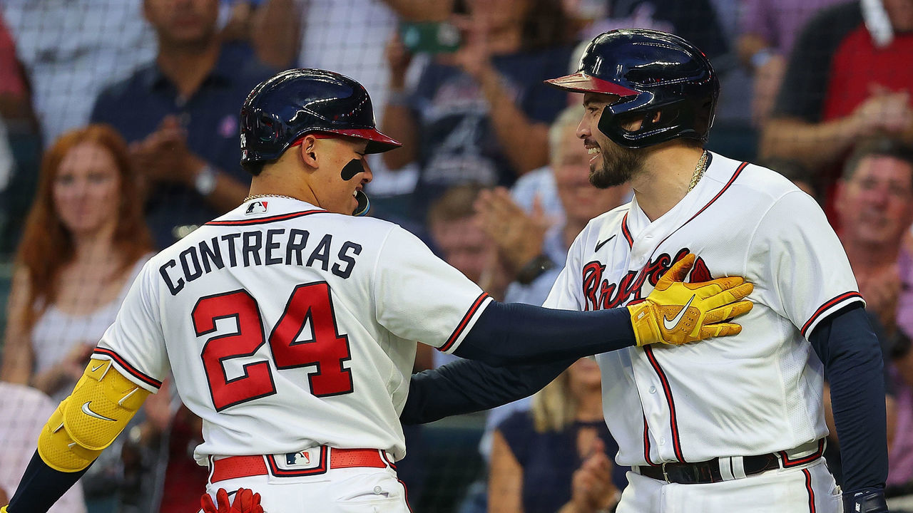 ATLANTA, GA - AUGUST 15: William Contreras #24 of the Atlanta Braves celebrates his solo home run to lead off the second inning with Travis d'Arnaud #16 at Truist Park on August 15, 2022 in Atlanta, Georgia.