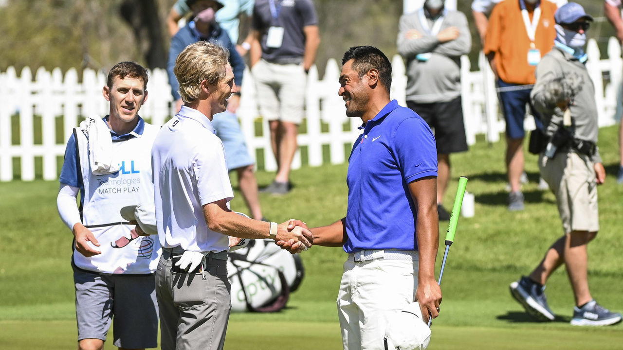 AUSTIN, TX - MARCH 25: Will Zalatoris and Tony Finau smile and shake hands after finishing their match tied on the 18th hole green during the second round of the World Golf Championships-Dell Technologies Match Play at Austin Country Club on March 25, 2021 in Austin, Texas.