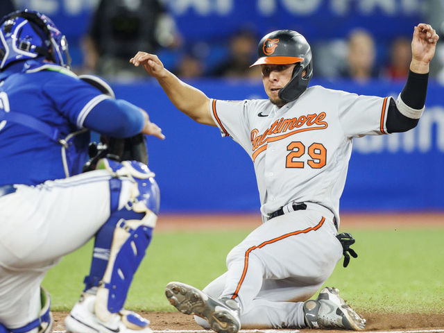 Baltimore Orioles' Jorge Mateo slides safely into home to score