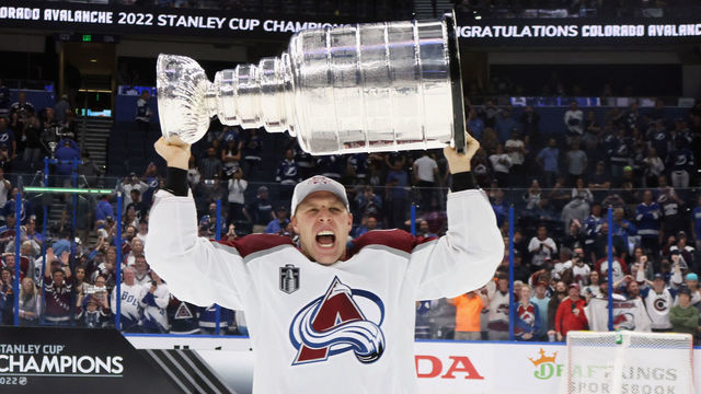 TAMPA, FLORIDA - JUNE 26: Jack Johnson #3 of the Colorado Avalanche carries the Stanley Cup following the series winning victory over the Tampa Bay Lightning in Game Six of the 2022 NHL Stanley Cup Final at Amalie Arena on June 26, 2022 in Tampa, Florida.