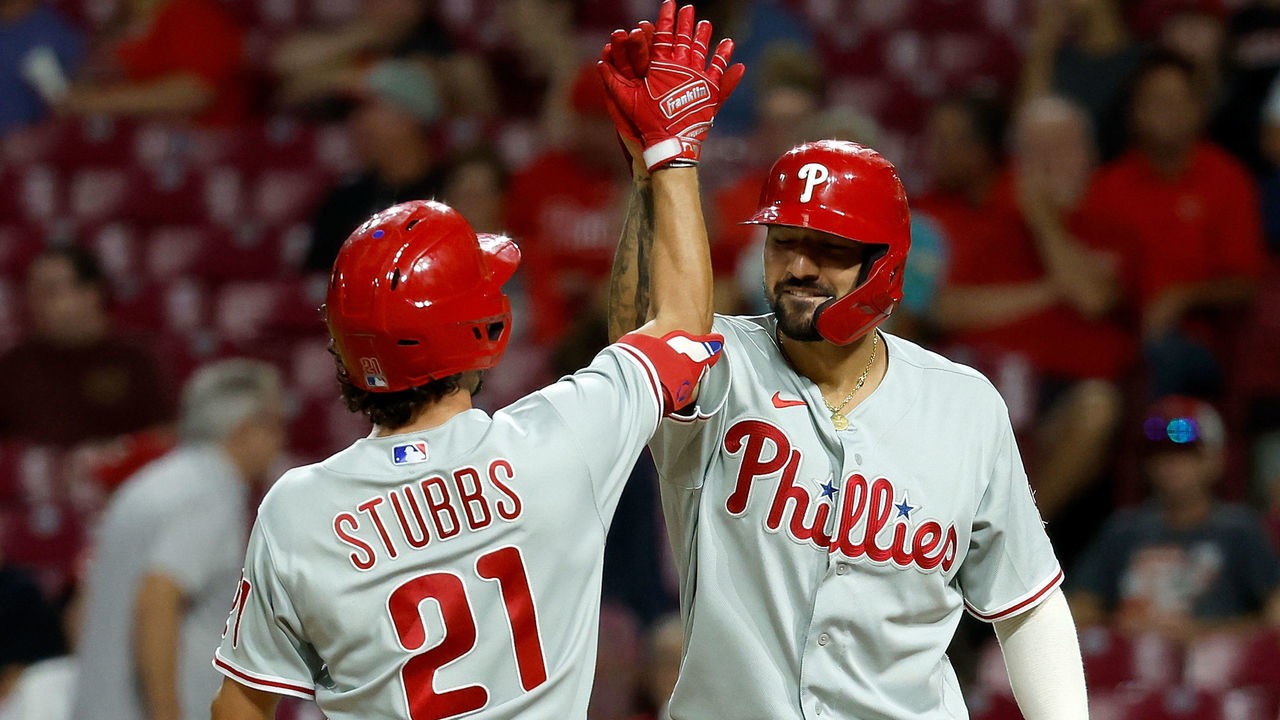 CINCINNATI, OH - AUGUST 16: Garrett Stubbs #21 of the Philadelphia Phillies is congratulated by Nick Castellanos #8 after hitting a three-run home run during the ninth inning of the game against the Cincinnati Reds at Great American Ball Park on August 16, 2022 in Cincinnati, Ohio. Philadelphia defeated Cincinnati 11-4.