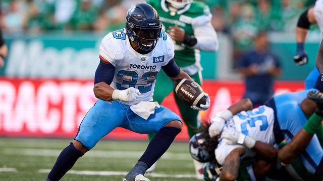 REGINA, SK - JULY 24: Andrew Harris #33 of the Toronto Argonauts carries the ball on a run play in the game between the Toronto Argonauts and Saskatchewan Roughriders at Mosaic Stadium on July 24, 2022 in Regina, Canada.