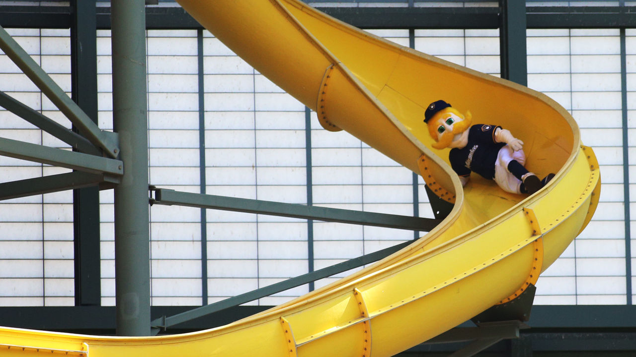 MILWAUKEE, WI - MAY 11: Bernie Brewer, the Brewers mascot slides down a  large slide after a home run is hit during the game between the Milwaukee  Brewers against the San Diego