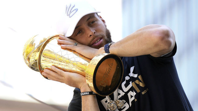 SAN FRANCISCO, CALIFORNIA - JUNE 20: Stephen Curry #30 of the Golden State Warriors celebrates with his NBA Finals Most Valuable Player Award during the Golden State Warriors Victory Parade on June 20, 2022 in San Francisco, California. The Golden State Warriors beat the Boston Celtics 4-2 to win the 2022 NBA Finals.