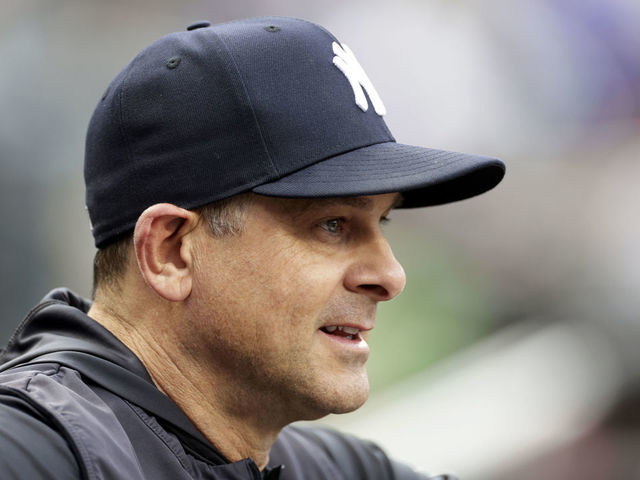 New York Yankees manager Aaron Boone (17) walks off the field