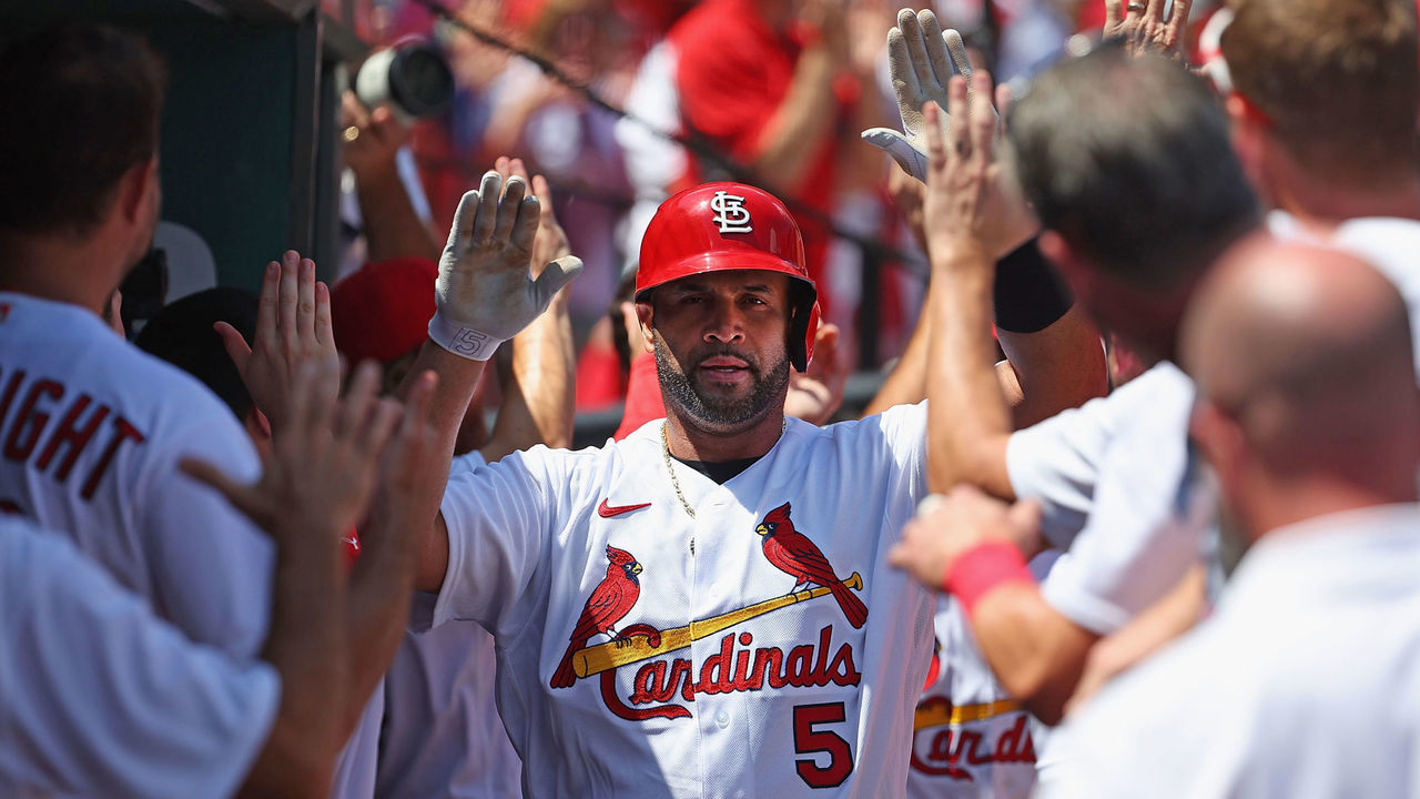 ST LOUIS, MO - AUGUST 18: Albert Pujols #5 of the St. Louis Cardinals his congratulated by teammates after hitting a grand slam against the Colorado Rockies in the third inning at Busch Stadium on August 18, 2022 in St Louis, Missouri.
