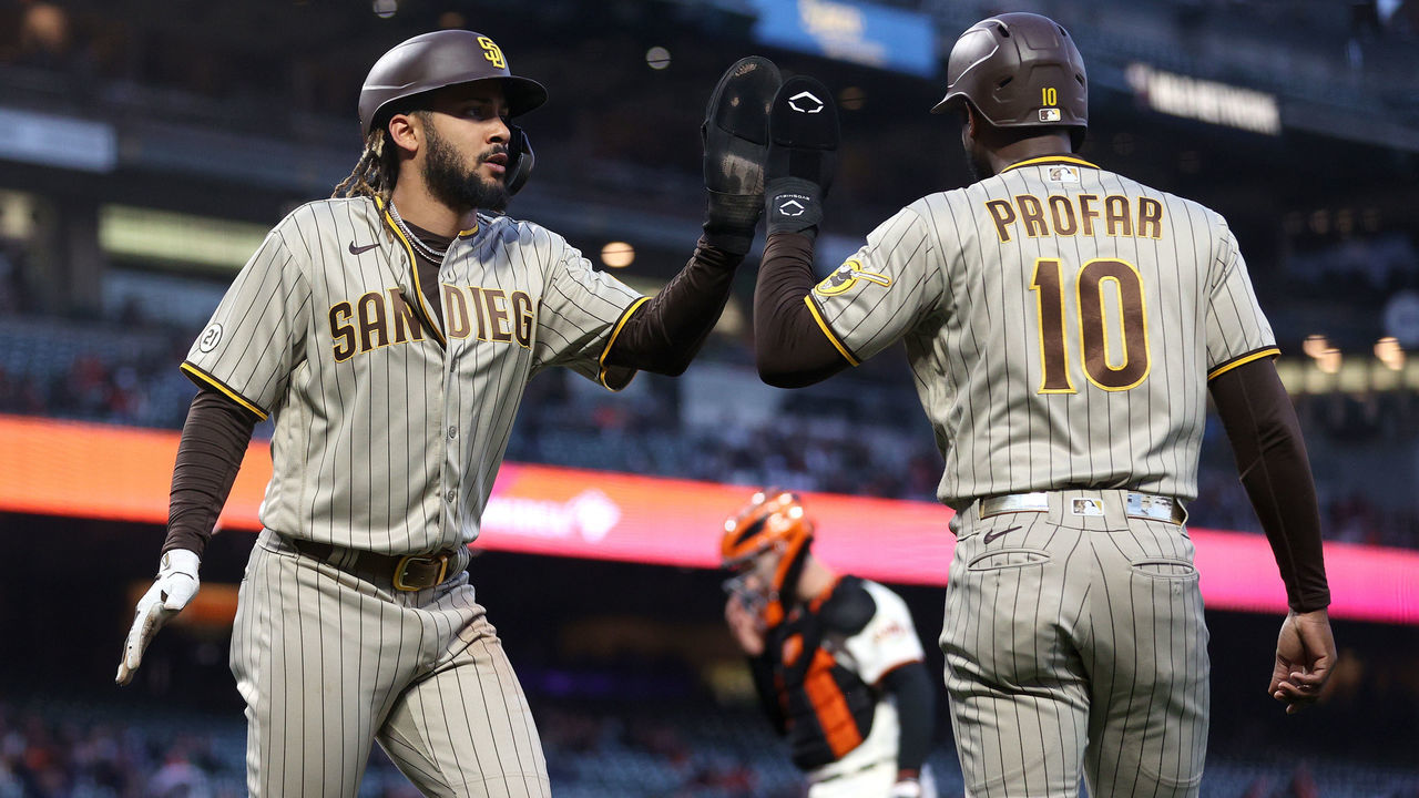 SAN FRANCISCO, CALIFORNIA - SEPTEMBER 15: Fernando Tatis Jr. #23 of the San Diego Padres is congratulated by Jurickson Profar #10 after he scored in the first inning against the San Francisco Giants at Oracle Park on September 15, 2021 in San Francisco, California.