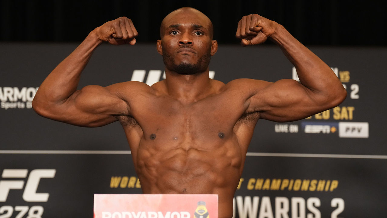 SALT LAKE CITY, UTAH - AUGUST 19: Kamaru Usman of Nigeria poses on the scale during the UFC 278 official weigh-in at Hilton Salt Lake City Center on August 19, 2022 in Salt Lake City, Utah.
