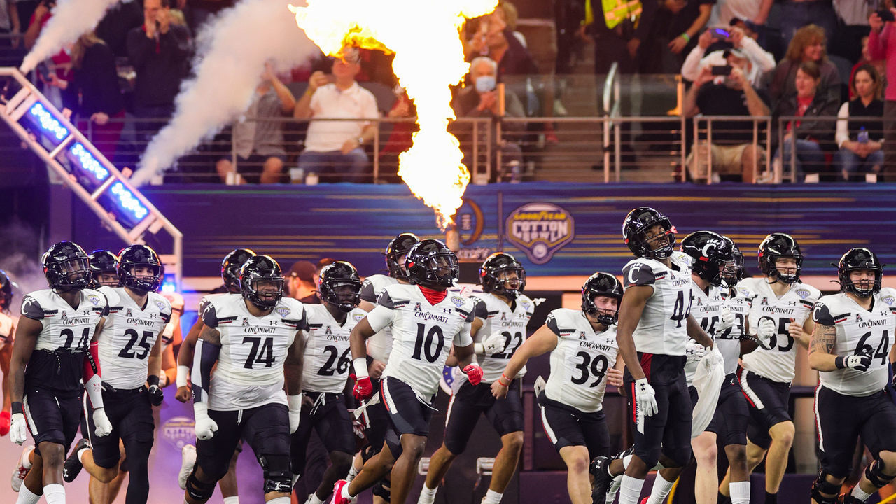 ARLINGTON, TEXAS - DECEMBER 31: Cincinnati Bearcat players take the field prior to playing the Alabama Crimson Tide in the Goodyear Cotton Bowl Classic for the College Football Playoff semifinal game at AT&T Stadium on December 31, 2021 in Arlington, Texas.
