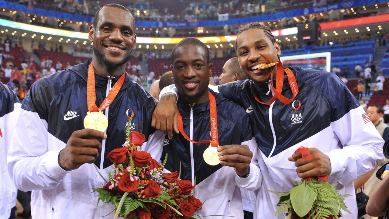 BEIJING - AUGUST 24: (L-R) LeBron James #6, Dwyane Wade #9 and Carmelo Anthony #15 of the U.S. Men's Senior National Team celebrates winning the men's gold medal basketball game at the 2008 Beijing Olympic Games at the Beijing Olympic Basketball gymnasium on August 24, 2008 in Beijing, China. The United States defeated Spain 118-107 to take the Men's Basketball gold medal. NOTE TO USER: User expressly acknowledges and agrees that, by downloading and/or using this Photograph, user is consenting to the terms and conditions of the Getty Images License Agreement. Mandatory Copyright Notice: Copyright 2008 NBAE