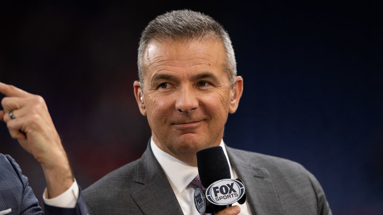 INDIANAPOLIS, IN - DECEMBER 07: Fox Sports analyst Urban Meyer on the sidelines before the Big 10 Championship game between the Wisconsin Badgers and Ohio State Buckeyes on December 7, 2019, at Lucas Oil Stadium in Indianapolis, IN.