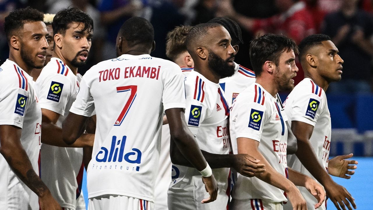 Lyons players celebrate after Lyons Brazilian forward Tete (2R) scored his team's third goal during the French L1 football match between Olympique Lyonnais (OL) and ES Troyes AC at The Groupama Stadium in Decines-Charpieu, central-eastern France on August 19, 2022.
