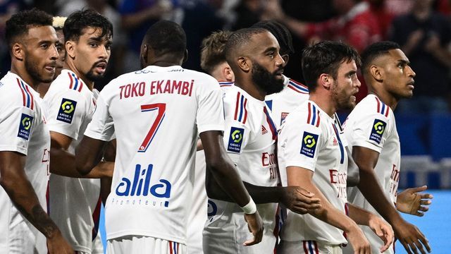 Lyons players celebrate after Lyons Brazilian forward Tete (2R) scored his team's third goal during the French L1 football match between Olympique Lyonnais (OL) and ES Troyes AC at The Groupama Stadium in Decines-Charpieu, central-eastern France on August 19, 2022.