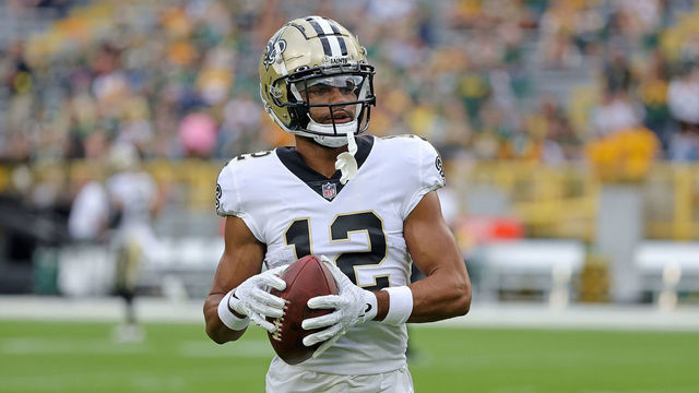 GREEN BAY, WISCONSIN - AUGUST 19: Chris Olave #12 of the New Orleans Saints participates in warmups prior to a preseason game against the Green Bay Packers at Lambeau Field on August 19, 2022 in Green Bay, Wisconsin.