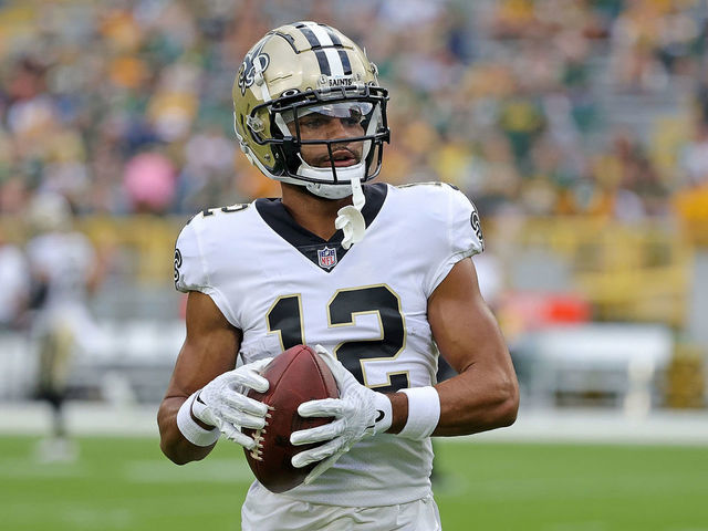 GREEN BAY, WISCONSIN - AUGUST 19: Chris Olave #12 of the New Orleans Saints participates in warmups prior to a preseason game against the Green Bay Packers at Lambeau Field on August 19, 2022 in Green Bay, Wisconsin.