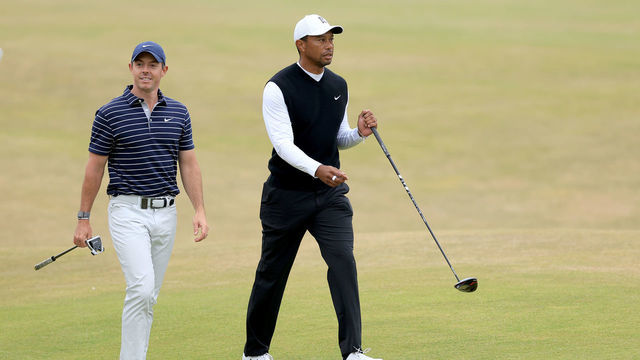 ST ANDREWS, SCOTLAND - JULY 11: Tiger Woods of The United States with Rory McIlroy of Norther Ireland during the Celebration of Champions prior to The 150th Open at St Andrews Old Course on July 11, 2022 in St Andrews, Scotland.