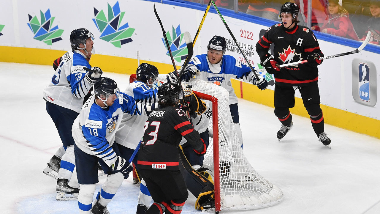 EDMONTON, AB - AUGUST 20: Ruben Rafkin #3 and Kasper Puutio #10 of Finland retrieve the puck off the net during the game against Canada in the IIHF World Junior Championship on August 20, 2022 at Rogers Place in Edmonton, Alberta, Canada