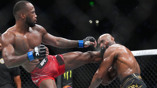 SALT LAKE CITY, UTAH - AUGUST 20: (L-R) Leon Edwards of Jamaica lands a head kick to Kamaru Usman of Nigeria in the UFC welterweight championship fight during the UFC 278 event at Vivint Arena on August 20, 2022 in Salt Lake City, Utah.