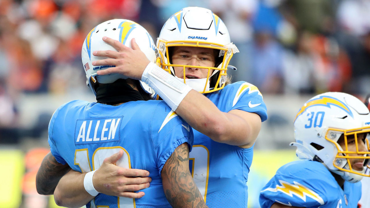 INGLEWOOD, CALIFORNIA - JANUARY 02: Keenan Allen #13 of the Los Angeles Chargers celebrates his touchdown with teammate Justin Herbert #10 during the second quarter against the Denver Broncos at SoFi Stadium on January 02, 2022 in Inglewood, California.