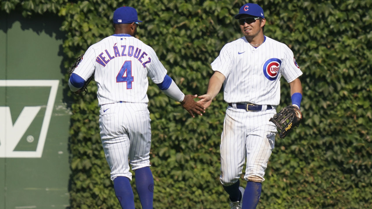 CHICAGO, ILLINOIS - AUGUST 23: Nelson Velazquez #4 and Seiya Suzuki #27 of the Chicago Cubs celebrate their team win over the St. Louis Cardinals in Game One of a doubleheader at Wrigley Field on August 23, 2022 in Chicago, Illinois. The Cubs defeated the Cardinals 2-0.