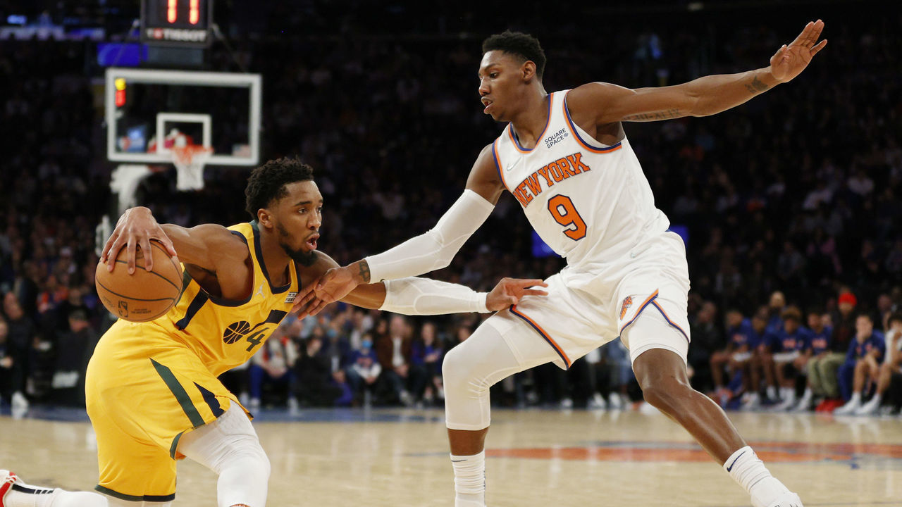 NEW YORK, NEW YORK - MARCH 20: Donovan Mitchell #45 of the Utah Jazz dribbles against RJ Barrett #9 of the New York Knicks during the second half at Madison Square Garden on March 20, 2022 in New York City. The Jazz won 108-93.