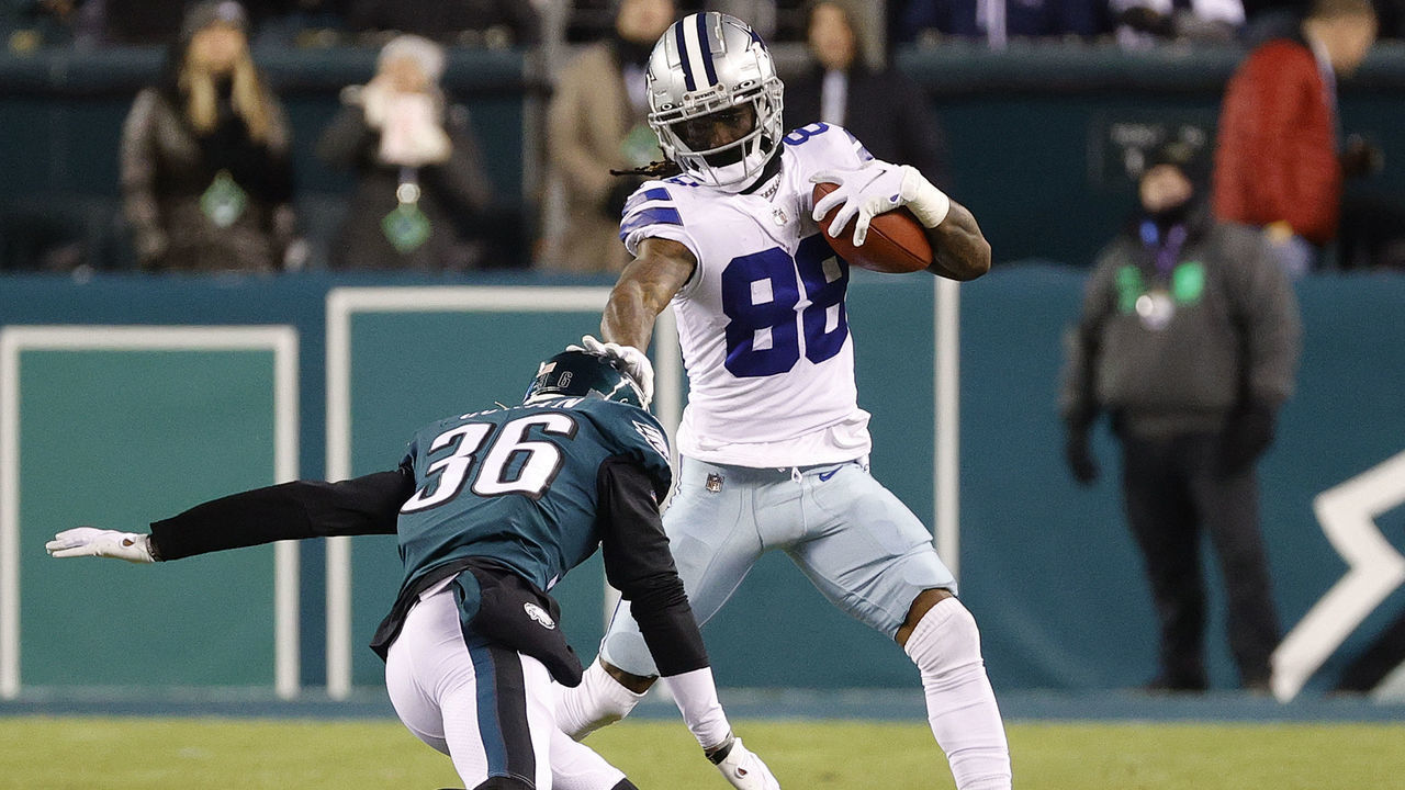 PHILADELPHIA, PENNSYLVANIA - JANUARY 08: CeeDee Lamb #88 of the Dallas Cowboys avoids a tackle from Tay Gowan #36 of the Philadelphia Eagles at Lincoln Financial Field on January 08, 2022 in Philadelphia, Pennsylvania.