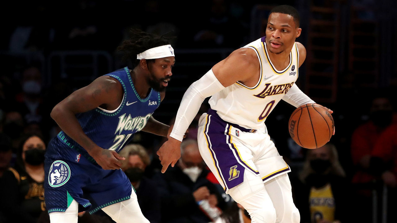 LOS ANGELES, CALIFORNIA - JANUARY 02: Russell Westbrook #0 of the Los Angeles Lakers handles the ball against Patrick Beverley #22 of the Minnesota Timberwolves during the first quarter at Crypto.com Arena on January 02, 2022 in Los Angeles, California.