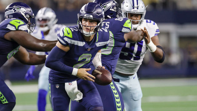 ARLINGTON, TX - AUGUST 26: Seattle Seahawks quarterback Drew Lock (2) looks to hand-off the football during the game between the Dallas Cowboys and the Seattle Seahawks on August 26, 2022 at AT&T Stadium in Arlington, Texas.