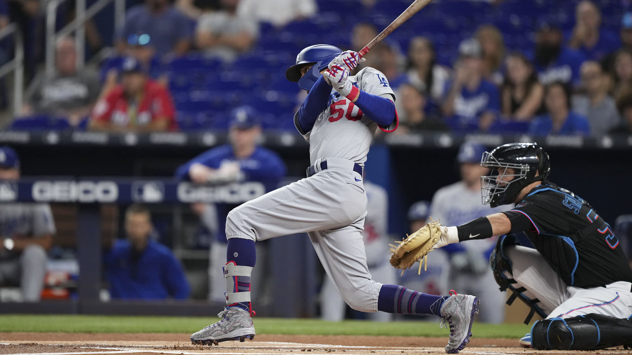 MIAMI, FLORIDA - AUGUST 26: Mookie Betts #50 of the Los Angeles Dodgers singles in the first inning against the Miami Marlins at loanDepot park on August 26, 2022 in Miami, Florida.