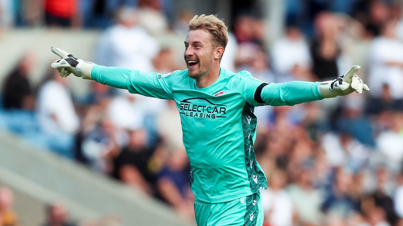 Reading Goalkeeper Joe Lumley celebrates after his sides first goal during the Sky Bet Championship match at The Den, London. Picture date: Saturday August 27, 2022.