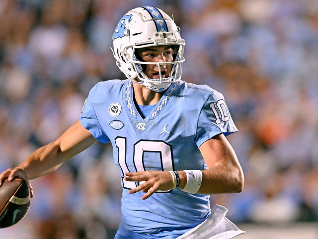 CHAPEL HILL, NORTH CAROLINA - AUGUST 27: Drake Maye #10 of the North Carolina Tar Heels rolls out against the Florida A&M Rattlers during the first half of their game at Kenan Memorial Stadium on August 27, 2022 in Chapel Hill, North Carolina.