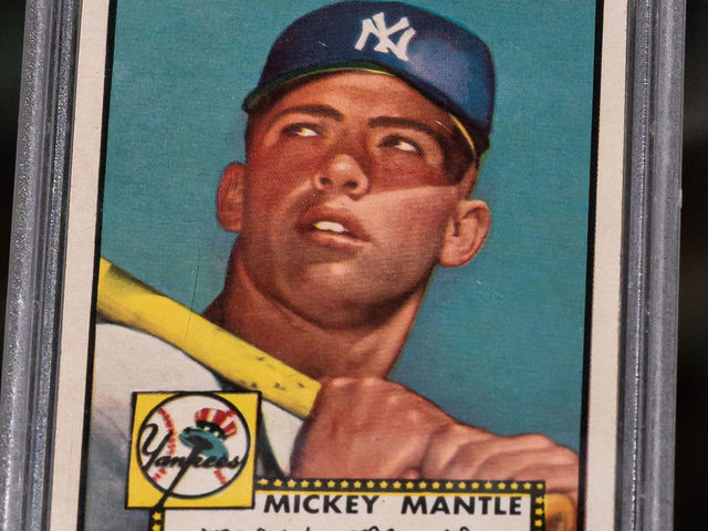 DENVER, CO - July 10, 2021: The 1952 Topps Mickey Mantle rookie card from the collection of Marshall Fogel arrives at McGregor Square's Rally Hotel. The card is graded PSA 10 Gem Mint and will be displayed as part of the Major League Baseball All-Star Game's Hall of Legends exhibit in Denver, CO.
