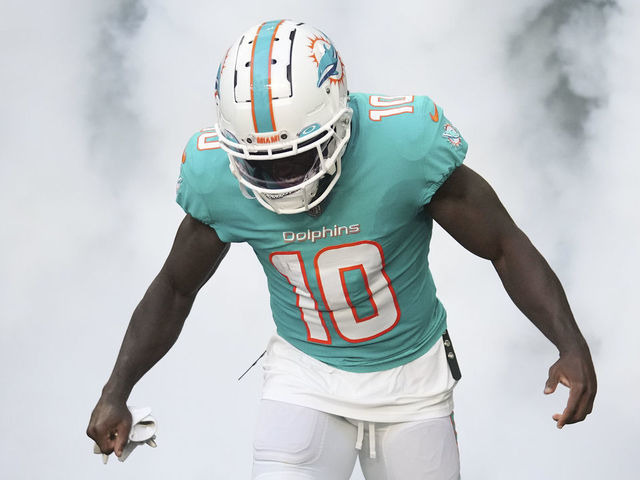 MIAMI GARDENS, FLORIDA - AUGUST 27: Tyreek Hill #10 of the Miami Dolphins takes the field prior to the preseason game against the Philadelphia Eagles at Hard Rock Stadium on August 27, 2022 in Miami Gardens, Florida.