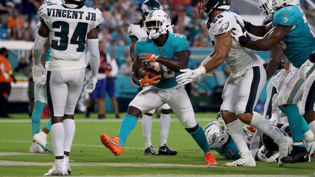 MIAMI GARDENS, FLORIDA - AUGUST 27: Sony Michel #28 of the Miami Dolphins rushes for a touchdown during the first quarter against the Philadelphia Eagles at Hard Rock Stadium on August 27, 2022 in Miami Gardens, Florida.
