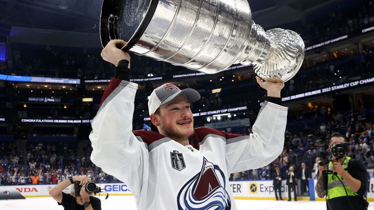 TAMPA, FLORIDA - JUNE 26: Cale Makar #8 of the Colorado Avalanche hoists the Stanley Cup after the Colorado Avalanche defeated the Tampa Bay Lightning in Game Six of the 2022 Stanley Cup Final at Amalie Arena on June 26, 2022 in Tampa, Florida. The Colorado Avalanche defeated the Tampa Bay Lightning 2-1 in Game Six to take the best of seven Stanley Cup Final series 4 games to 2.