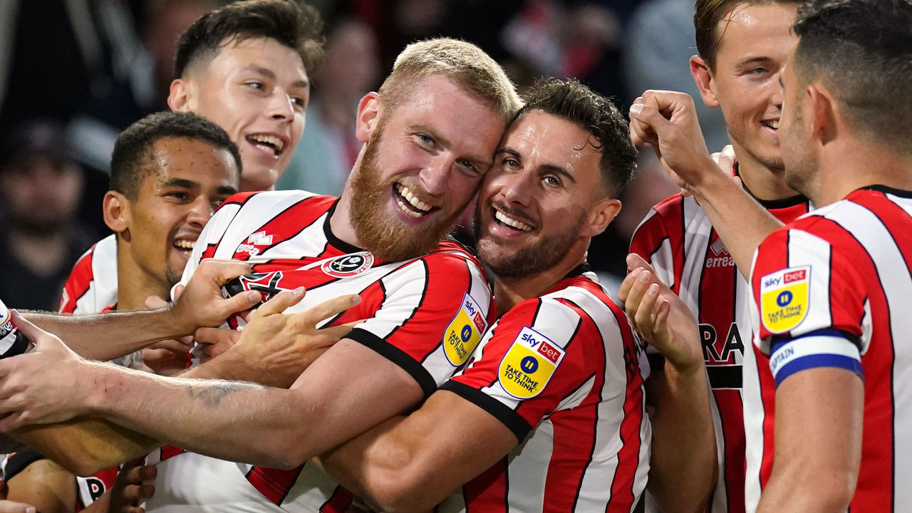 Sheffield United's Oliver McBurnie (second left) celebrates scoring their side's first goal of the game during the Sky Bet Championship match at Bramall Lane, Sheffield. Picture date: Tuesday August 30, 2022.