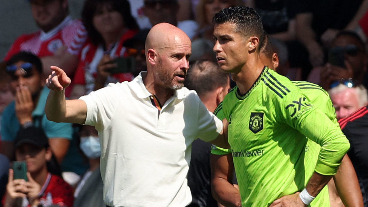Manchester United's Dutch manager Erik ten Hag (L) directs substitute Manchester United's Portuguese striker Cristiano Ronaldo during the English Premier League football match between Southampton and Manchester United at St Mary's Stadium in Southampton, southern England on August 27, 2022. - RESTRICTED TO EDITORIAL USE. No use with unauthorized audio, video, data, fixture lists, club/league logos or 'live' services. Online in-match use limited to 120 images. An additional 40 images may be used in extra time. No video emulation. Social media in-match use limited to 120 images. An additional 40 images may be used in extra time. No use in betting publications, games or single club/league/player publications.
