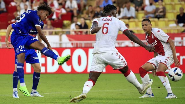 Troyes' French midfielder Wilson Odobert (L) scores a goal during the French L1 football match between AS Monaco and ES Troyes AC at the Louis II Stadium (Stade Louis II) in the Principality of Monaco on August 31, 2022.